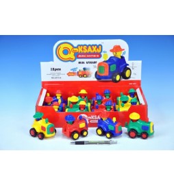 Traktor plast 9cm s pohybující se figurkou na setrvačník; 4 barvy - 1 kus